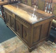 A large oak carved coffer.