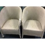 Two Lloyd Loom type chairs.