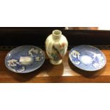 Two Chinese blue and white plates together with a