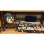 A small old toilet mirror together with a collecti