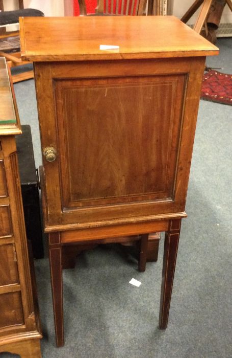 A mahogany inlaid cupboard.