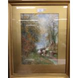 A gilt framed watercolour depicting cattle. Signed to bottom left. Approx