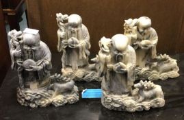 Four Chinese soapstone figures.