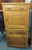 A pair of oak bedside cabinets.