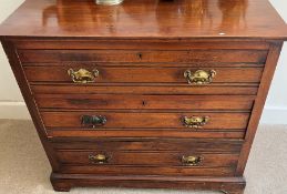 A mahogany chest of three drawers.