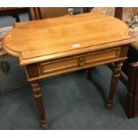 A mahogany single drawer side-table.