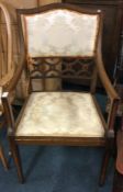 An Edwardian inlaid chair.