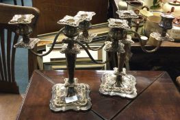 A pair of silver plated candelabra.