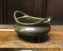 A small Chinese two handled bowl. Marked to base.