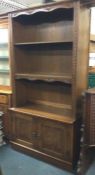 An oak carved bookcase.