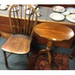 An Antique stick back chair together with a table.