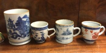 Four Chinese blue and white mugs.