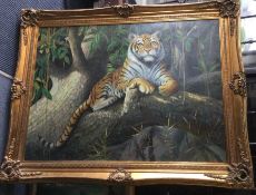 An oversized gilt framed oil on canvas of a tiger