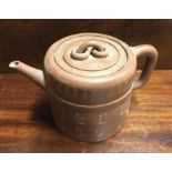 A Chinese terracotta teapot. Marked to base.