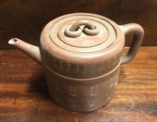 A Chinese terracotta teapot. Marked to base.