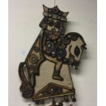 A large unusual pottery wall plaque depicting a ki