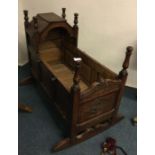An old carved child's cot.