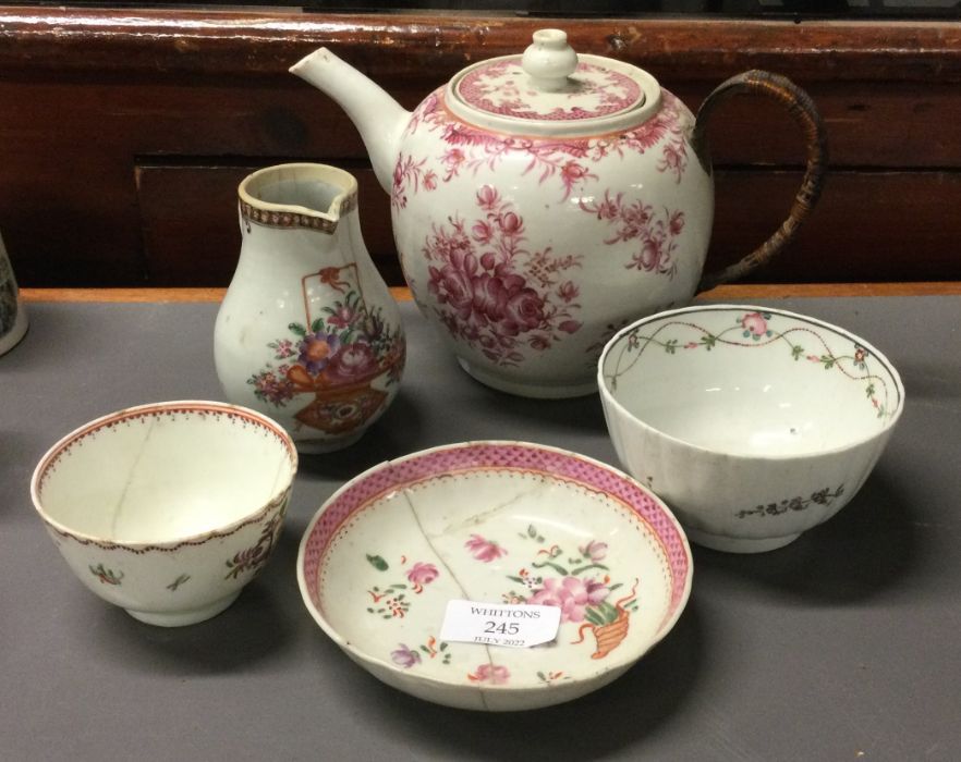 A good Chinese cream jug together with other potte