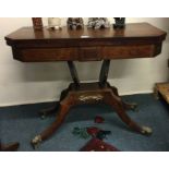 A mahogany and brass inlaid card table.