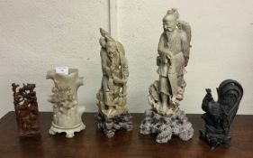 Five carved Oriental figures.