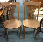 A pair of good oak chairs.