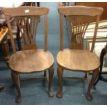A pair of good oak chairs.