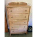 A limed oak chest of drawers.