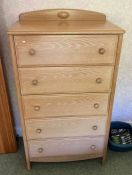 A limed oak chest of drawers.