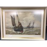 A framed and glazed watercolour of fishing boats i