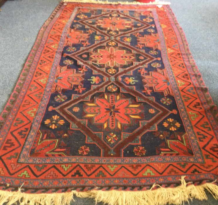 A large rug decorated in bright colours.