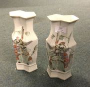 A pair of tall Chinese vases, decorated with figur