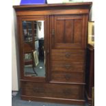 An Edwardian mahogany compactum wardrobe.