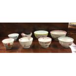 A group of eight Chinese tea bowls.