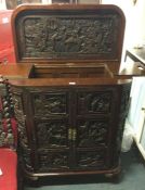An Eastern carved cocktail cabinet.