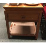 A Continental hardwood bedside cabinet.