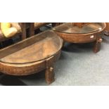 A pair of glass top occasional tables.