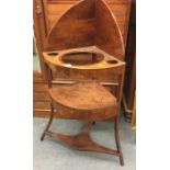 A Georgian mahogany corner washstand.