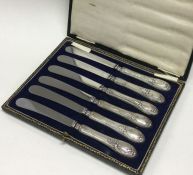 A cased set of six silver handled knives. Est. £20