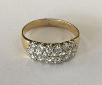 A good diamond three row ring in 18 carat gold mou