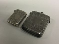 Two attractively engraved silver vesta cases with