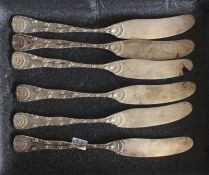 A heavy set of six Sterling silver butter knives.