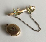 A small gold brooch together with a locket. Approx.