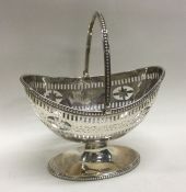 A heavy Georgian silver swing handled basket with