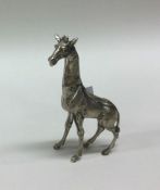 PATRICK MAVROS: A silver figure of a giraffe. Appr