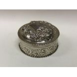 A large chased silver dressing table box decorated