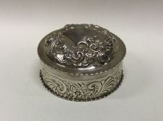 A large chased silver dressing table box decorated