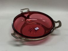 A silver and cranberry glass sweet dish of circula