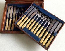 A cased set of twelve (plus twelve) bone handled d