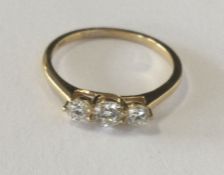 A good diamond 3 stone ring in 18 carat claw mount