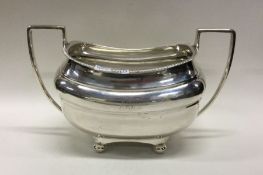 A heavy Georgian style silver sugar basket with sh